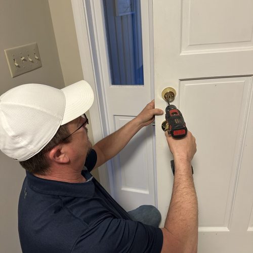 Winchester VA locksmith installing new door lock hardware during a residential lock replacement service.