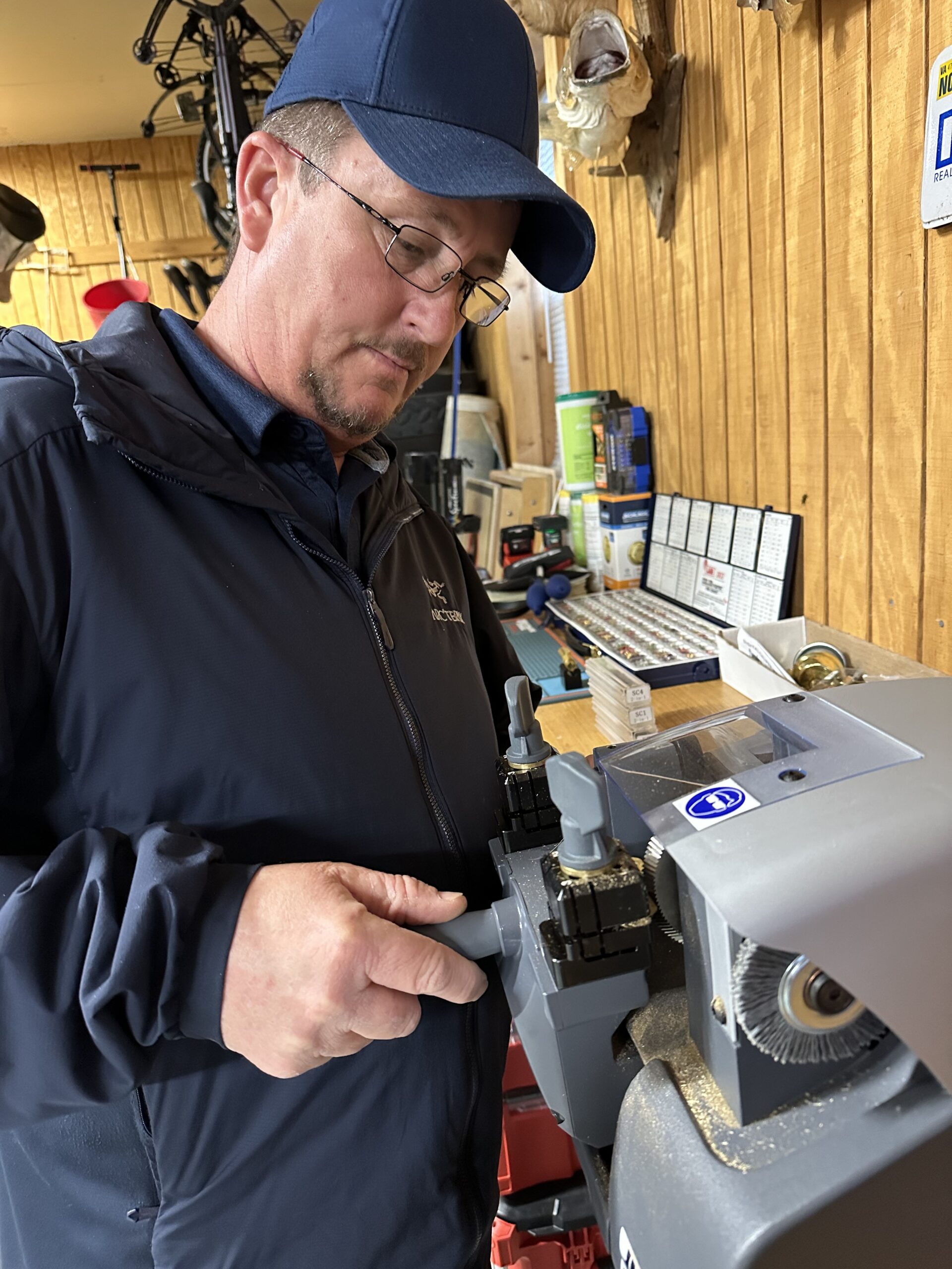 Precision Lock and Key owner cutting a key in the Winchester, VA workshop