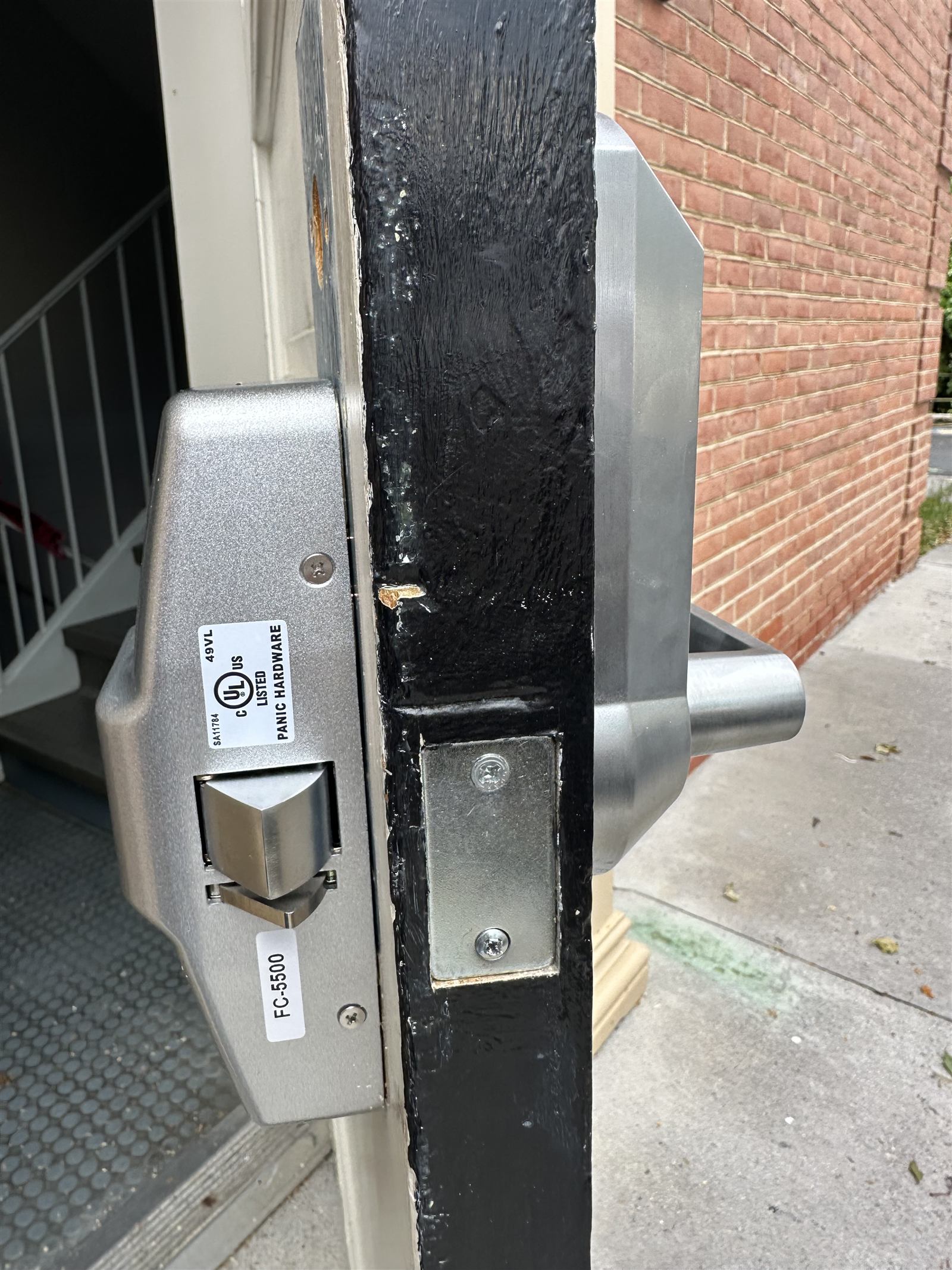 Commercial panic bar exit device installed on a business door in Winchester VA